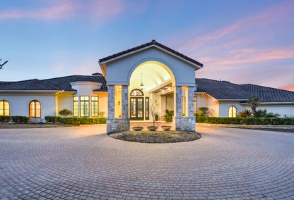 Exterior of luxury home located in West Lake Hills, TX during sunset